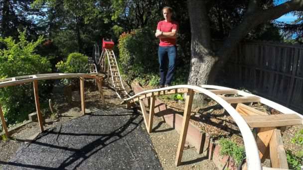 father and son build rollercoaster