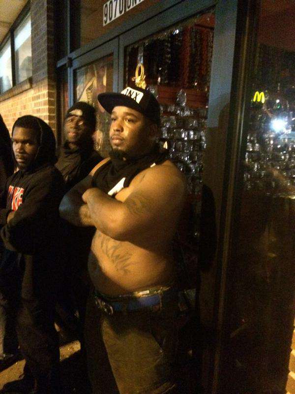 young men guarding store