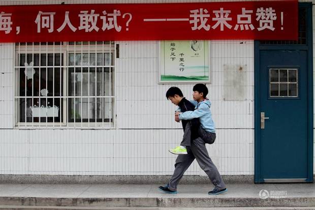 chinese student carries freind every day