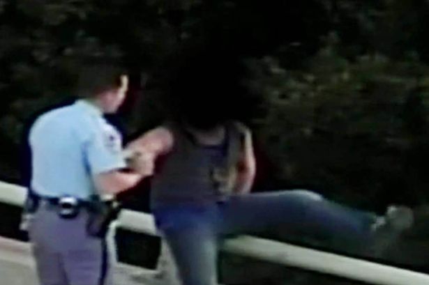 Raleigh-Police-Officer-talks-man-off-bridge-and-gives-him-a-hug