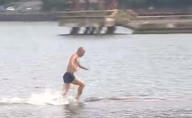 monk running on water