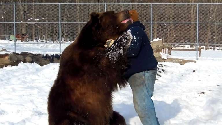 bear_hug_kisses_orphan_160112.nbcnews-ux-1080-600
