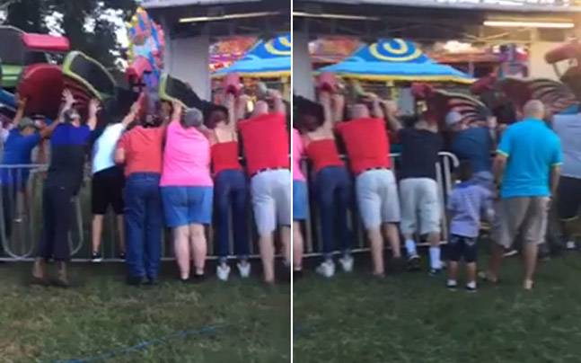 bystanders hold up rollercoaster