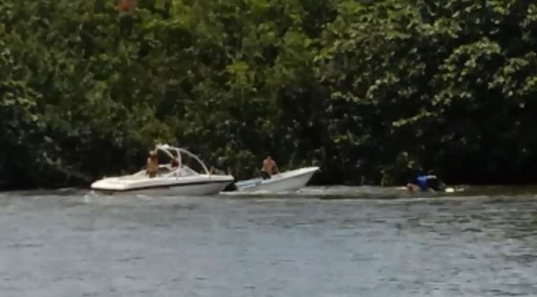 samaritan jumps into out of control boat