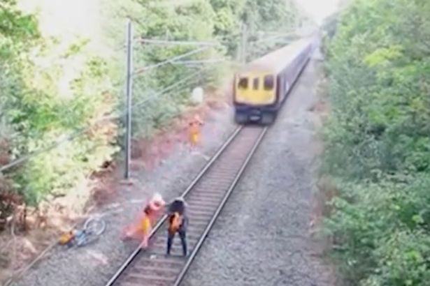 rail-worker-saves-a-man-on-the-tracks-from-an-incoming-train