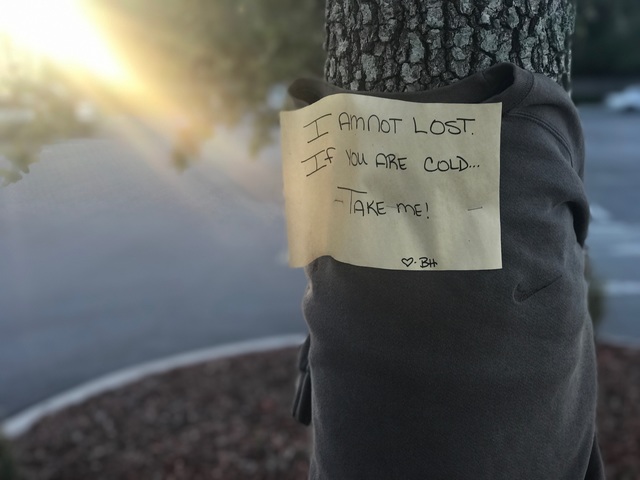 moms leaving sweaters on trees