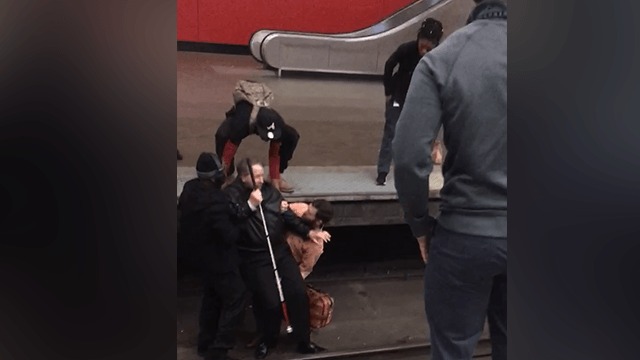 samaritans rescue man who fell onto train tracks