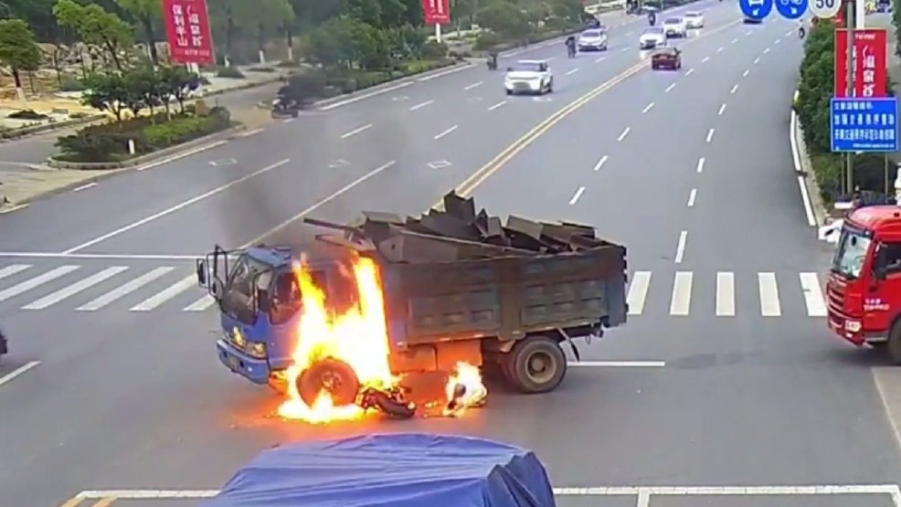 chinese motorocyclist crashes into dump truck