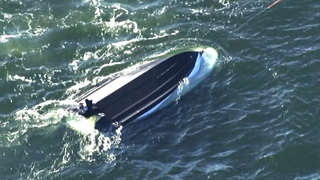 samaritans rescue people from overturned boat