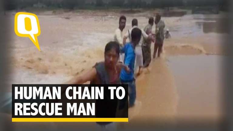 samaritans form human chain to rescue man