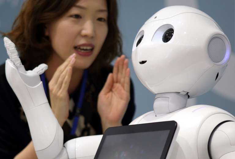 SoftBank Corp.'s Humanoid Robot Pepper Interacts With Customers At A SoftBank Store