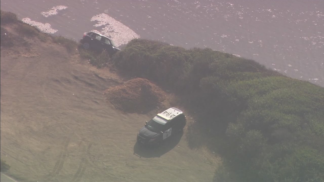 car teetering on cliff