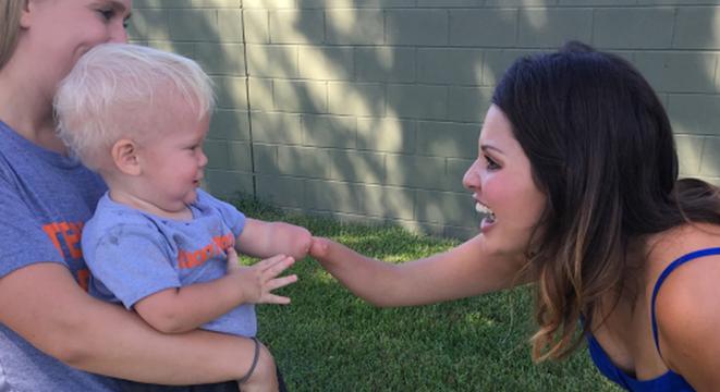 little boy hugs woman with same limb difference