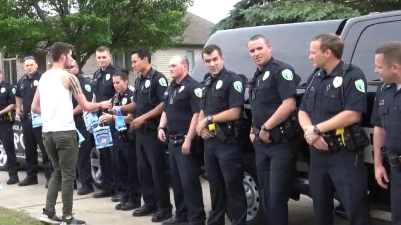 officers surprise fallen officers son at graduation party