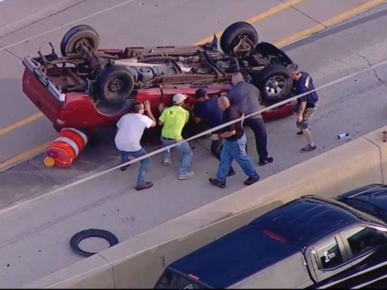 good samaritans flip overturned truck