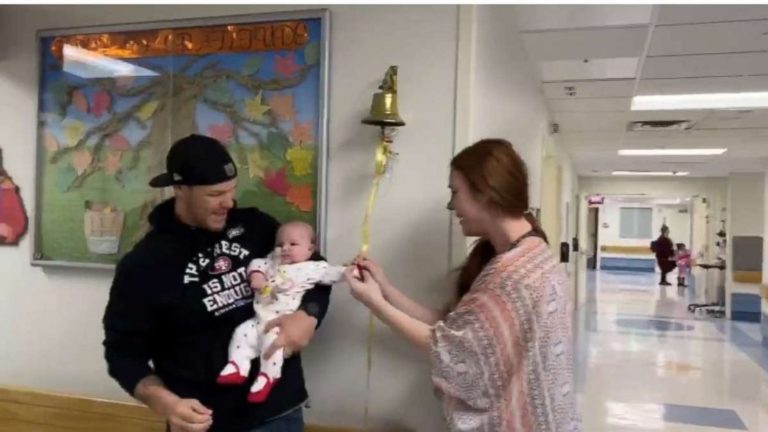 mom-helps-baby-ring-bell-after-beating-brain-cancer